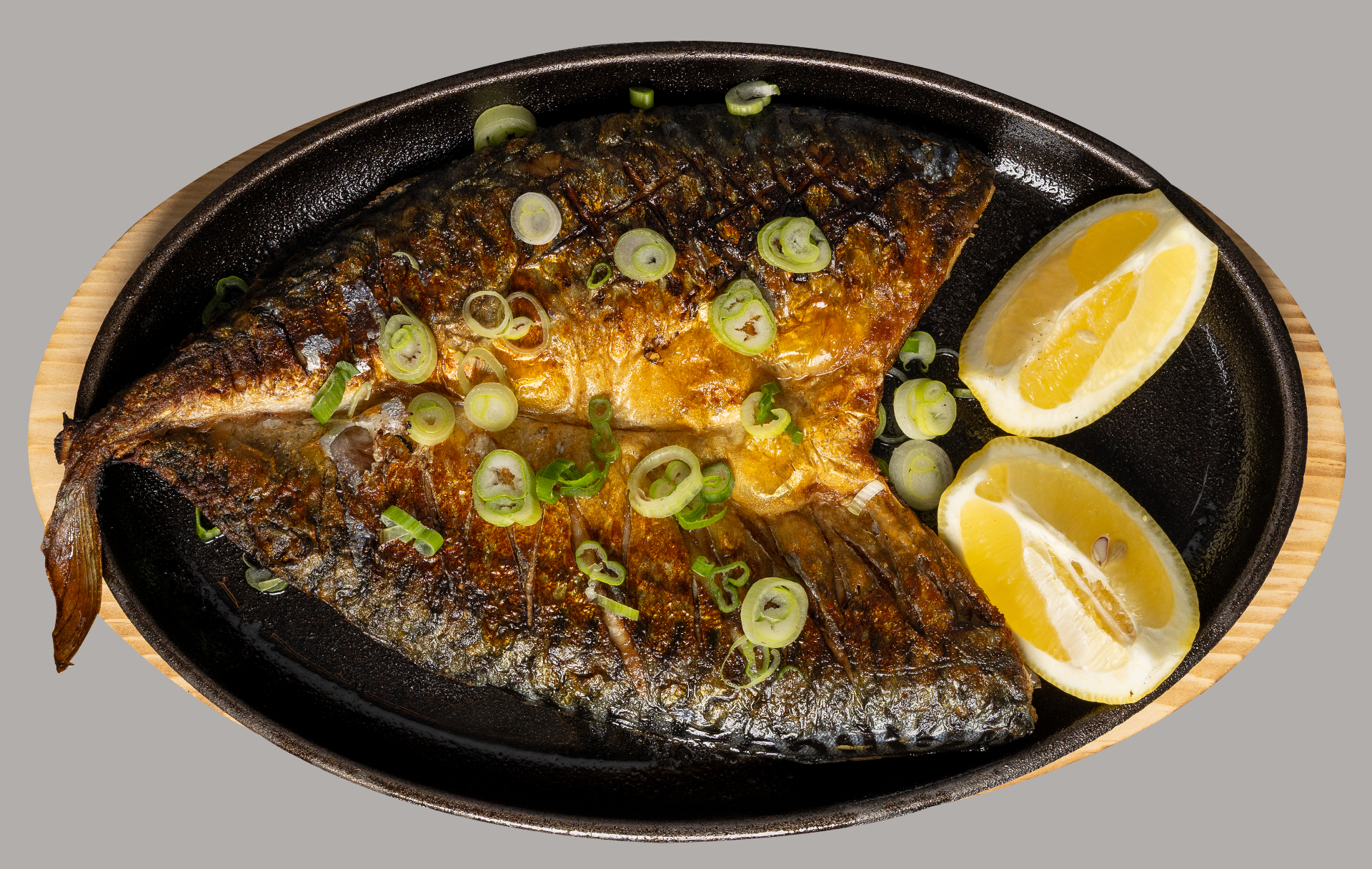 Grilled whole fish with lemon and scallions